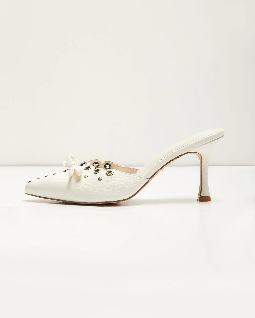 Mara Grommet and Bow Pointed Toe Mules